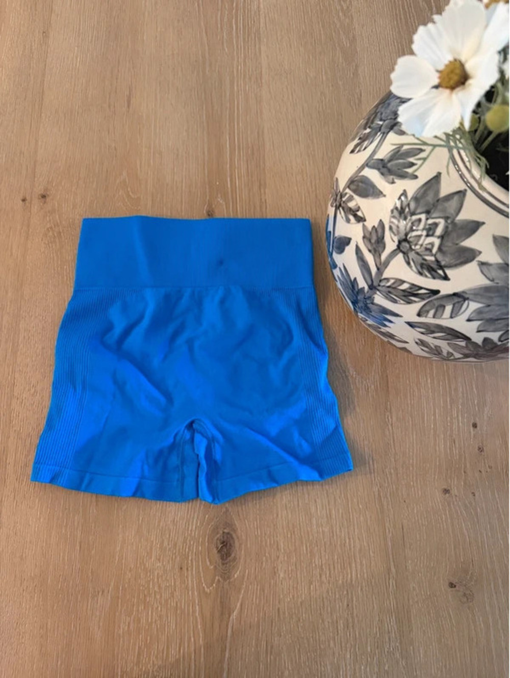 Blue high-waisted shorts with ruched detail